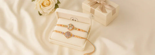 Decorative rakhi bracelets in a gift box with a rose and ribbon-wrapped present