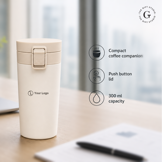 White coffee tumbler with push-button lid with TGS branding.