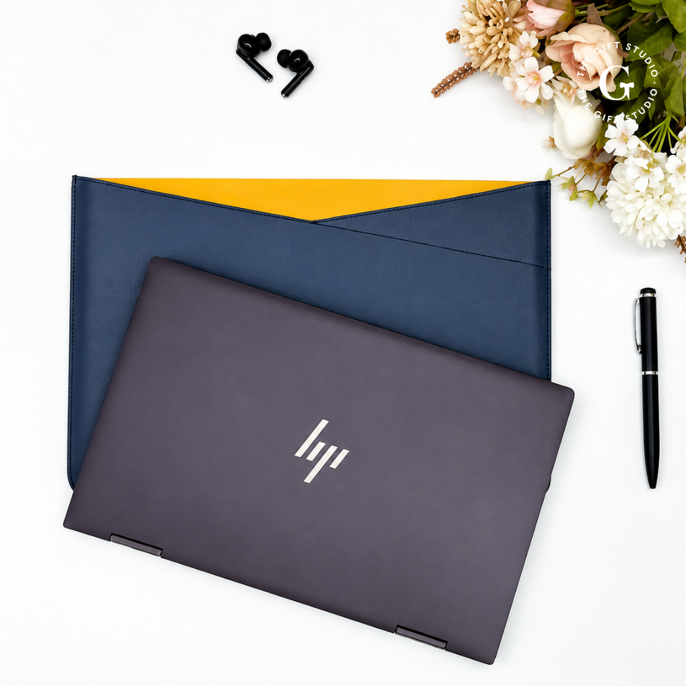 Navy blue laptop sleeve with a TGS branding logo