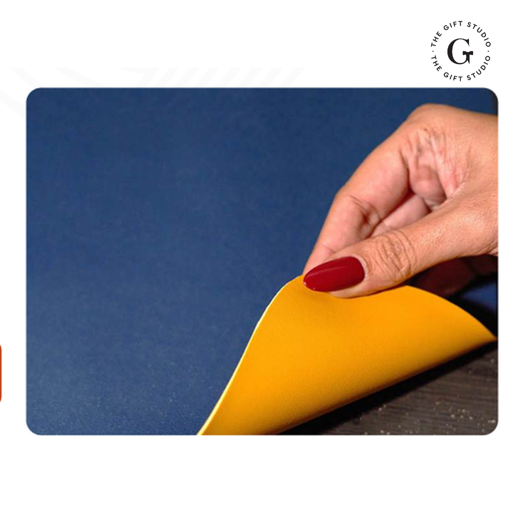 Yellow mouse pad featuring 'Your Logo' and 'The Gift Studio' branding.