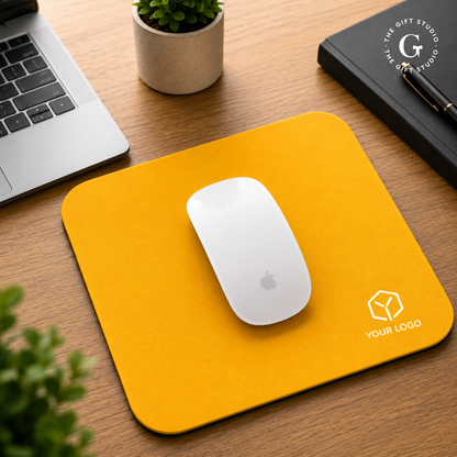 Yellow mouse pad featuring 'Your Logo' and 'The Gift Studio' branding.