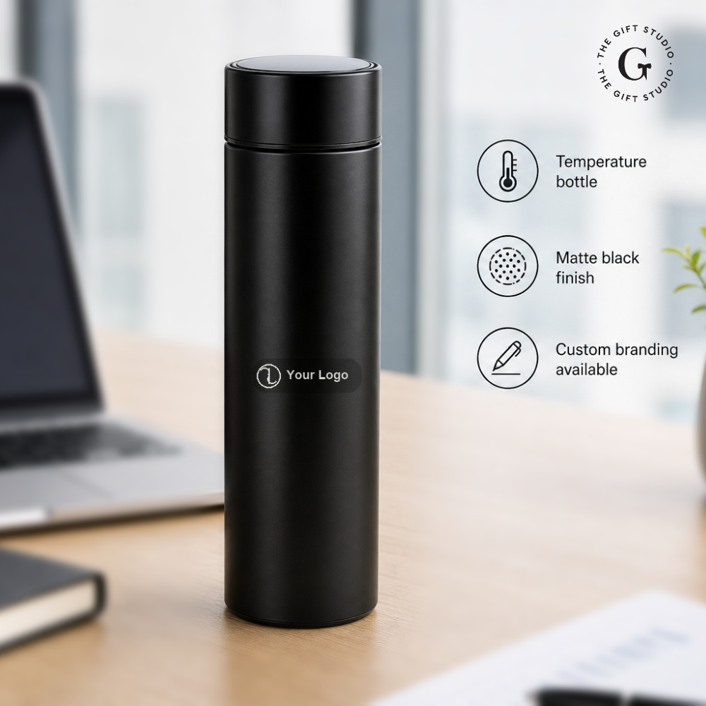 Black temperature bottle on a desk with featuring TGS branding 