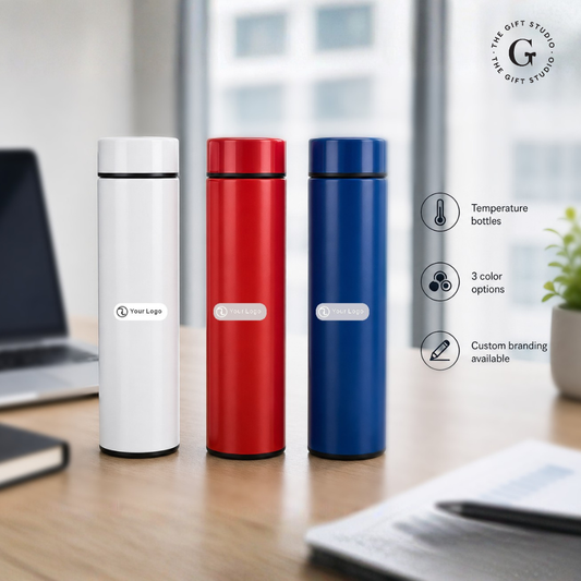 Three thermos bottles in white, red, and blue with TGS branding.