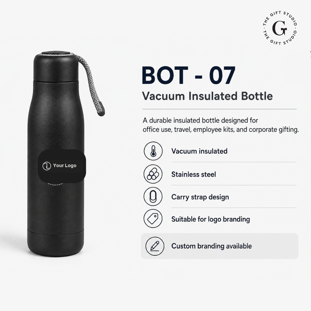 Black vacuum insulated bottle on a desk with branded 'The Gift Studio'.