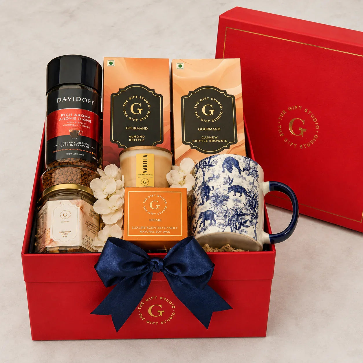 All Coffee & Crunch hamper items neatly arranged inside the open red gift box