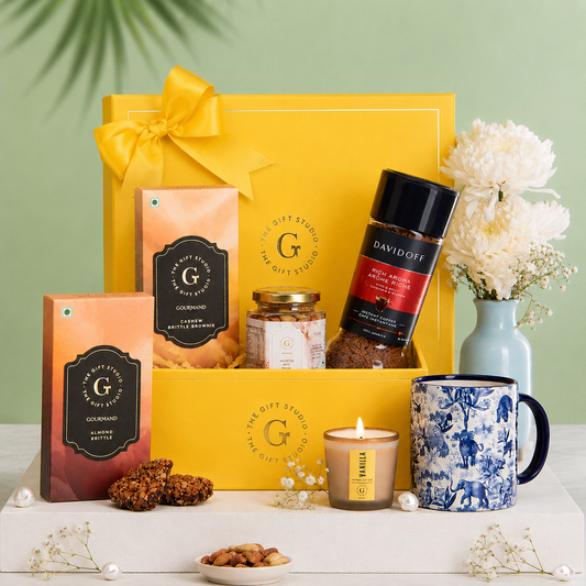 Coffee & Crunch products artfully displayed outside the yellow gift box.