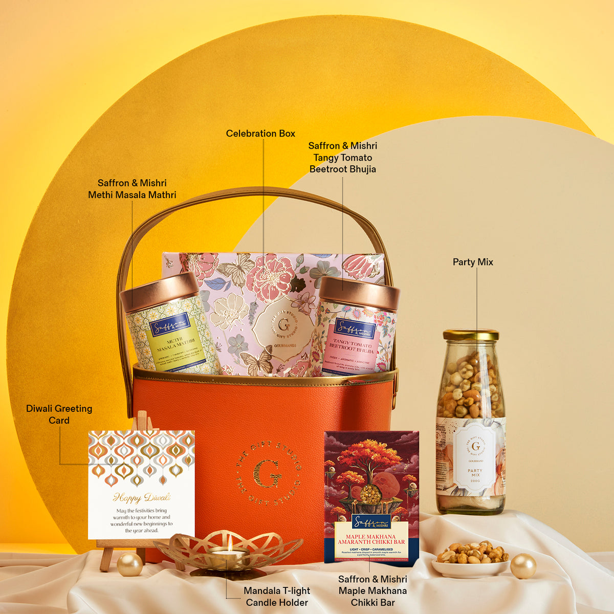 The Gift Studio Diwali Floral & Treats Hamper with assorted snacks and a greeting card.