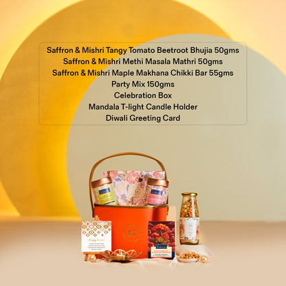 The Gift Studio Diwali Floral & Treats Hamper with gourmet snacks and candle holder.