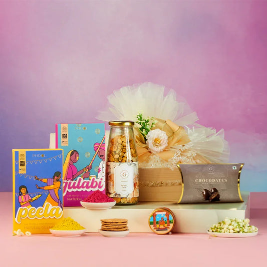 Holi gift hamper with snacks, sweets, natural gulal, and festive packaging on a pastel background.