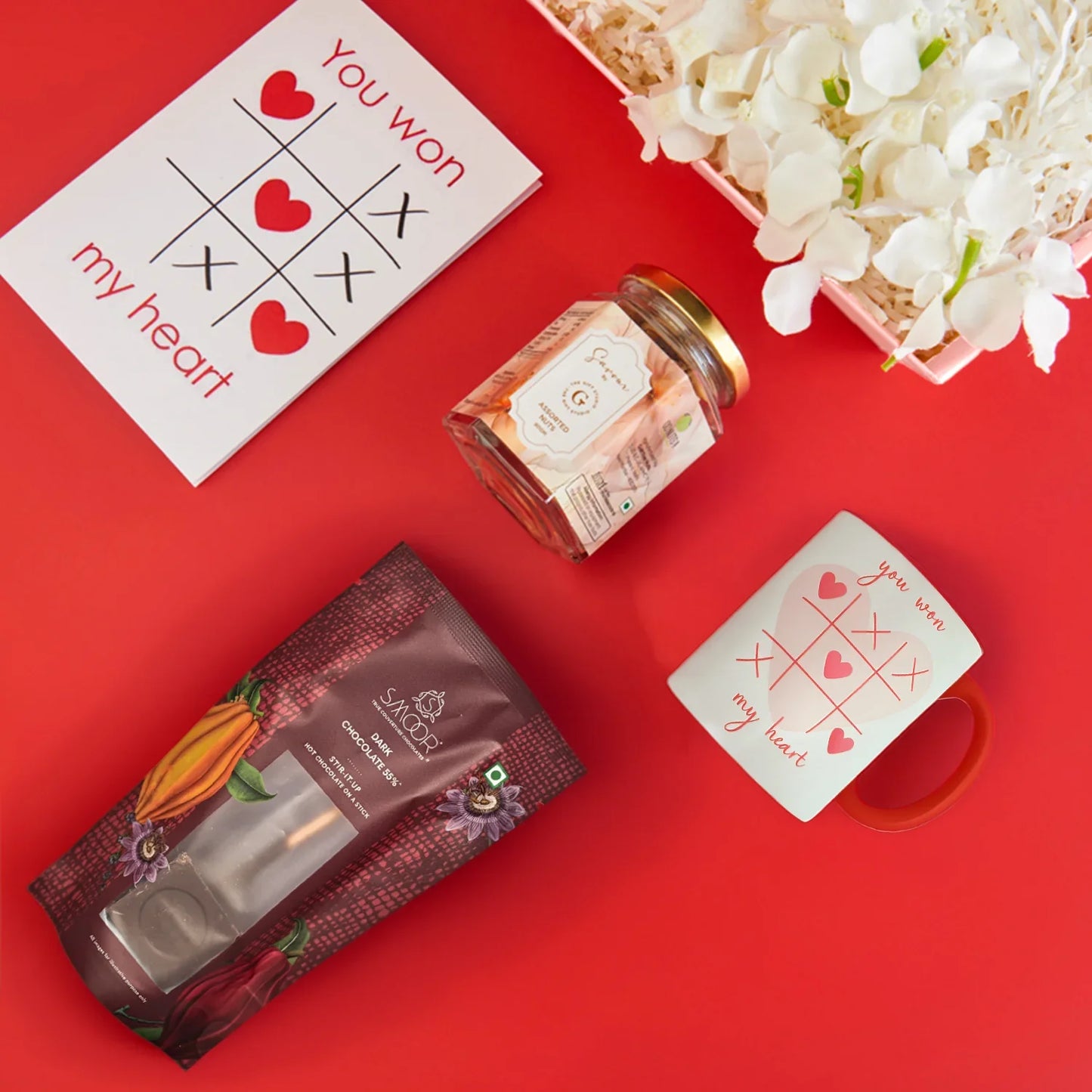 A top-down flat lay showing the full Hug me Tight hamper assortment.