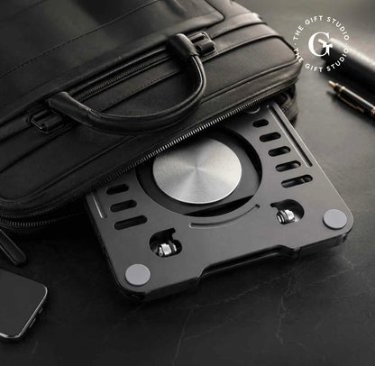 Metallic cardholder on a dark surface with a black bag