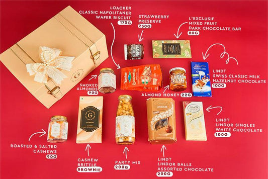 A top-down flat lay showing the full Bump to Mighty Celebration Trunk assortment.
