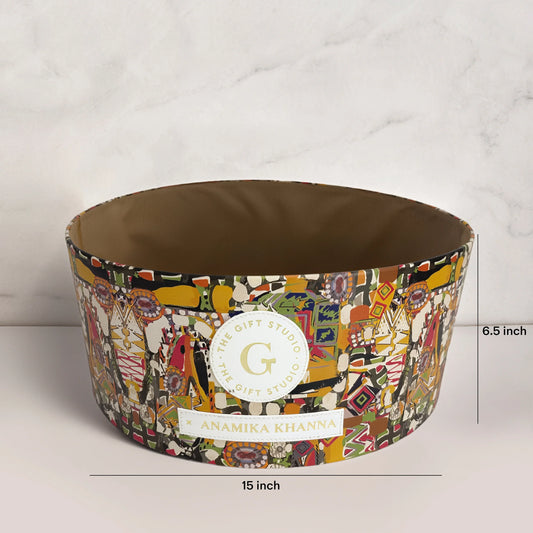 Colorful 15-inch round gift box with geometric print and Anamika Khanna label, 6.5-inch tall