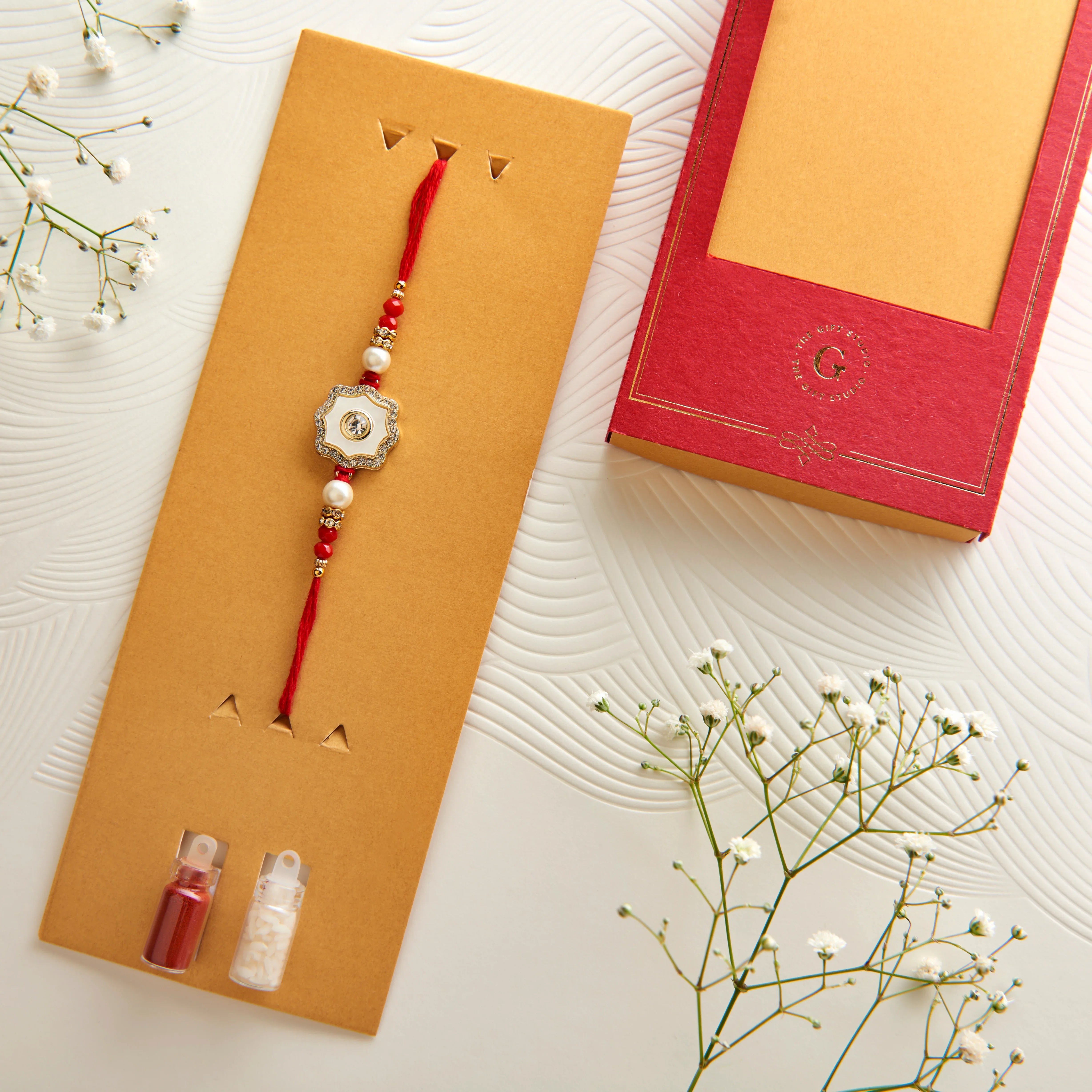 The Mother of Pearl Rakhi with CZ Embellishment