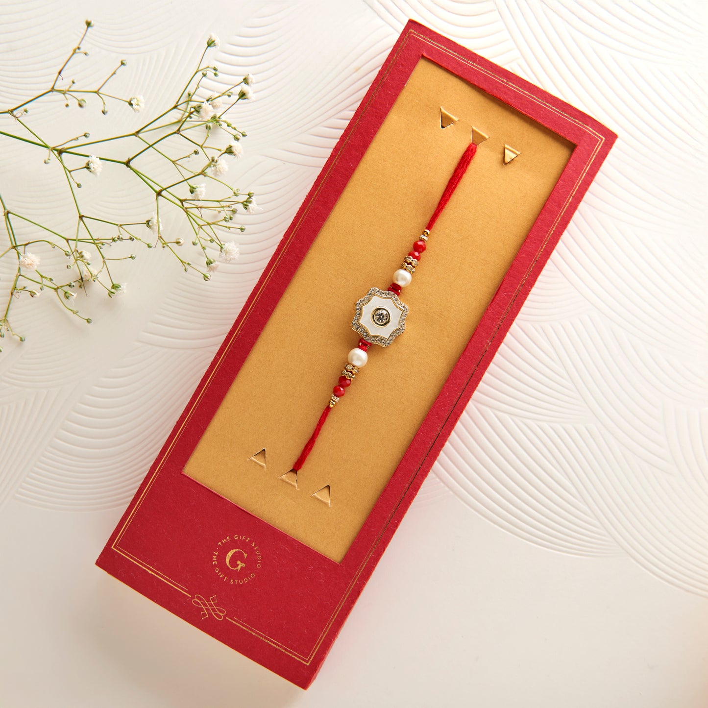 The Mother of Pearl Rakhi with CZ Embellishment
