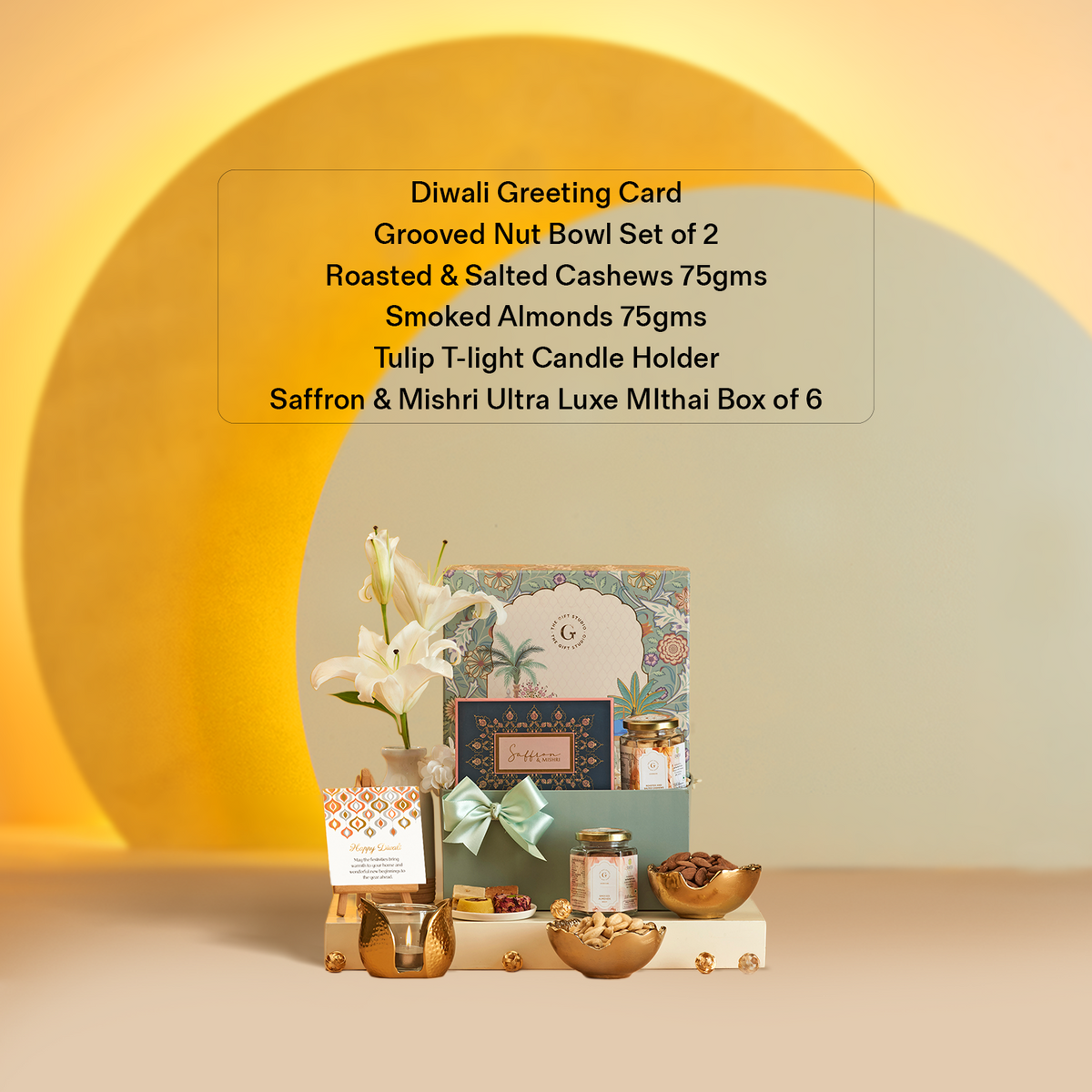 The Diwali Soirée Hamper by The Gift Studio featuring nuts, sweets, and a candle holder.