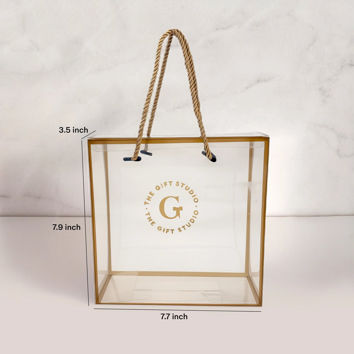 Transparent gift bag with golden border, rope handles, and dimensions labeled