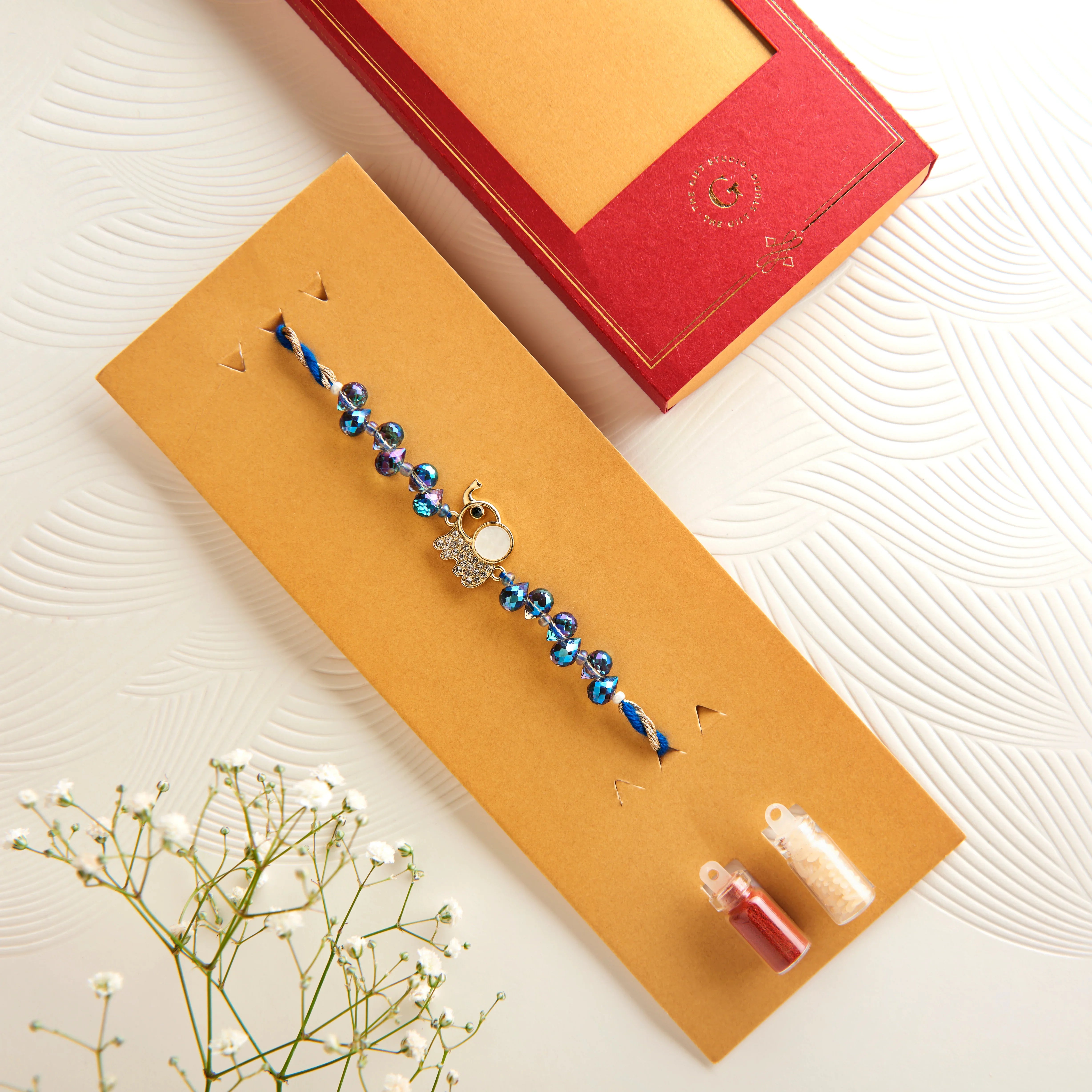 Trendy Mother of Pearl & CZ Elephant Rakhi